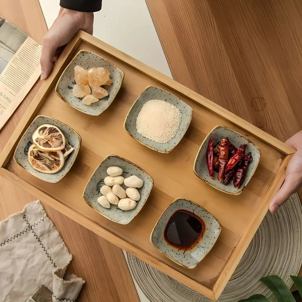 Ceramic sauce plate with speckled glaze and sea life motifs, perfect for soy sauce and dips