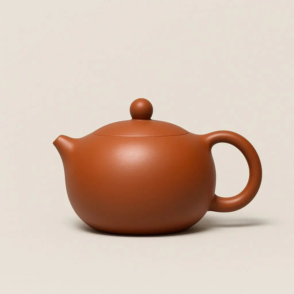 Red clay ceramic teapot with traditional lid knob design, handcrafted for authentic tea brewing experience