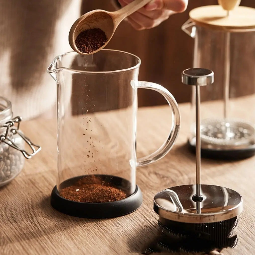 Precision stainless steel filter mechanism in heat-resistant glass french press for smooth brewing