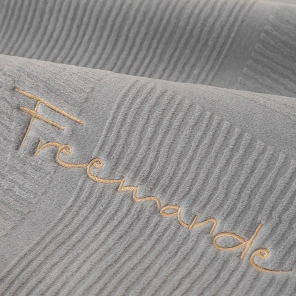 Fitted flannel couch cover with slip-resistant backing for daily furniture protection