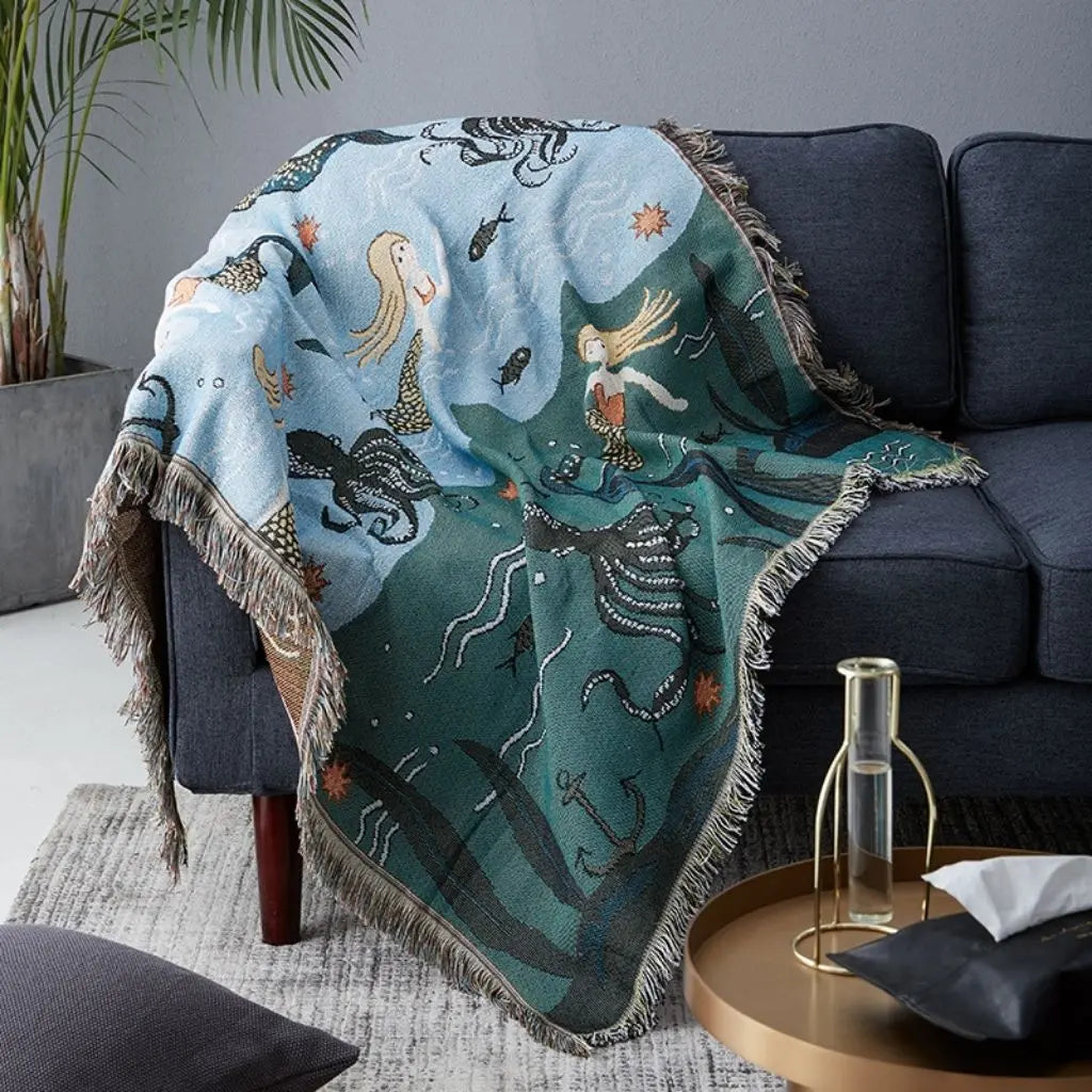 Woven throw blanket featuring detailed mermaid pattern and sea life motifs for living room