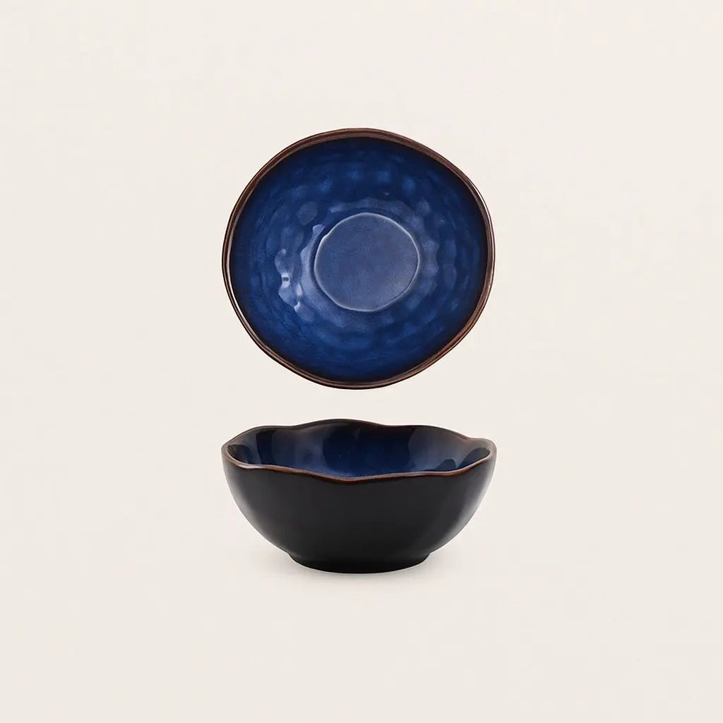 Handcrafted ceramic deep bowl with irregular artistic shape, perfect for modern dining and creative serving