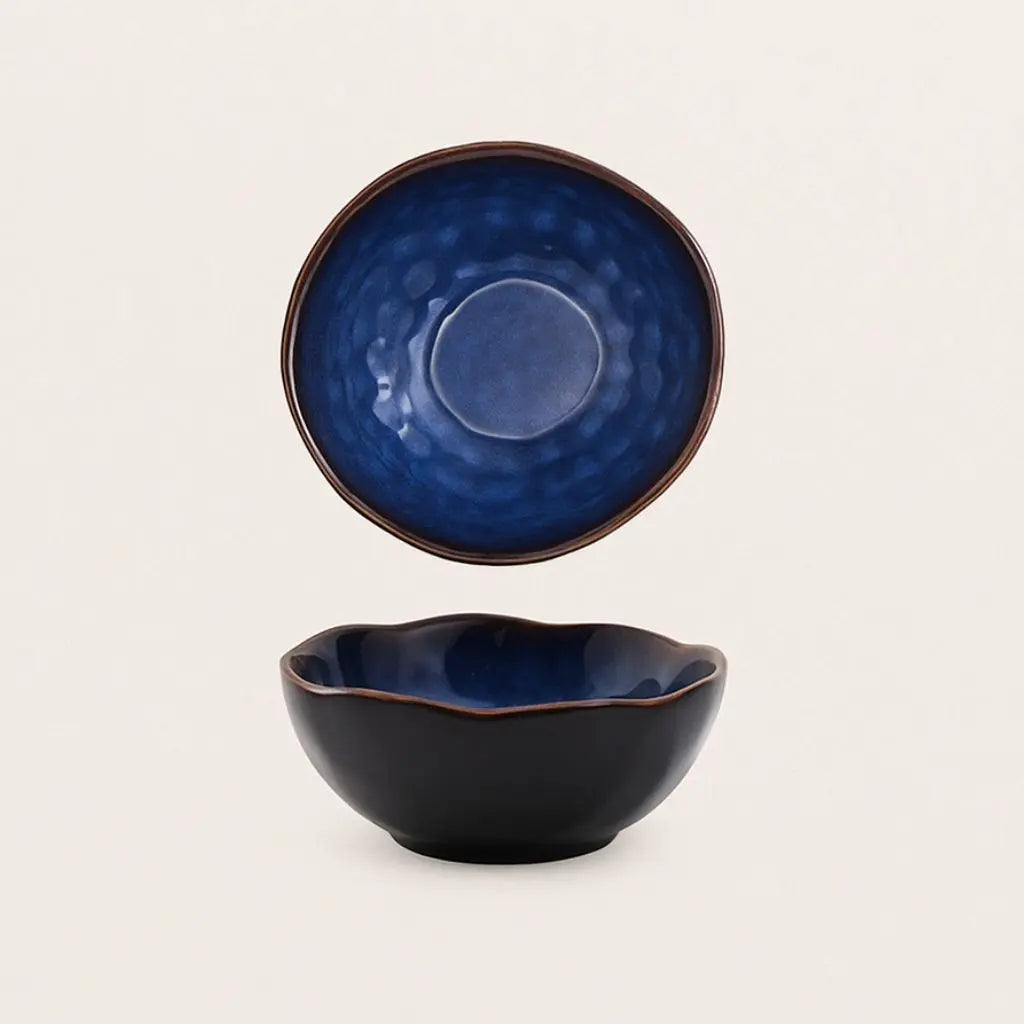 Modern ceramic dinnerware with irregular sculptural design, perfect for contemporary serving styles