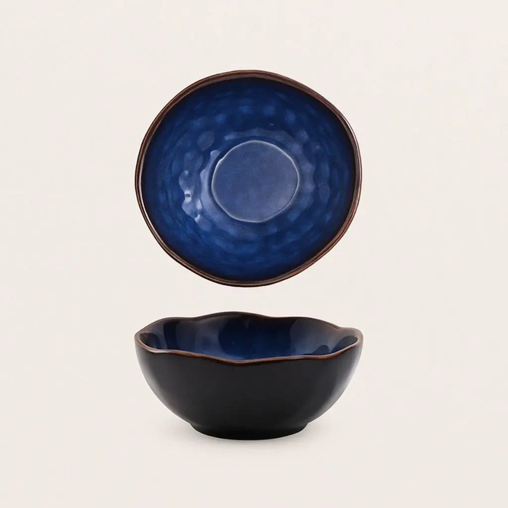 Artisan ceramic bowl featuring irregular sculptural design, handmade tableware for creative dining