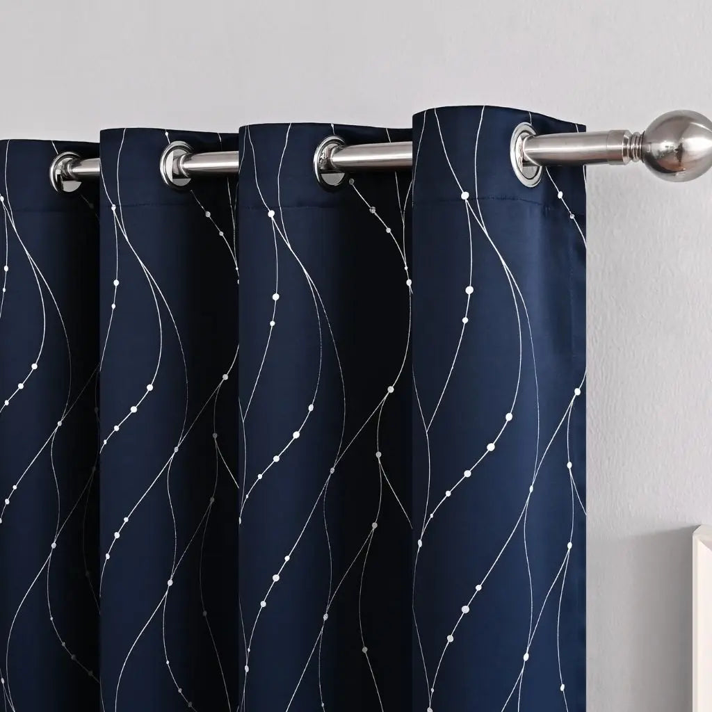 Blackout curtains with subtle wave patterns in navy blue, designed for complete light control and modern home decor
