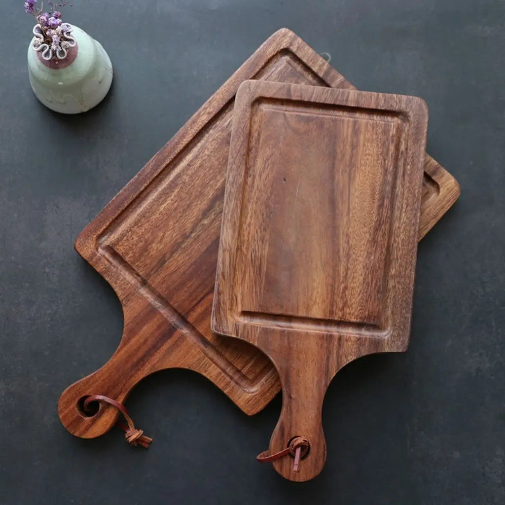 Handcrafted wooden cutting board with integrated handle designed for efficient kitchen prep work