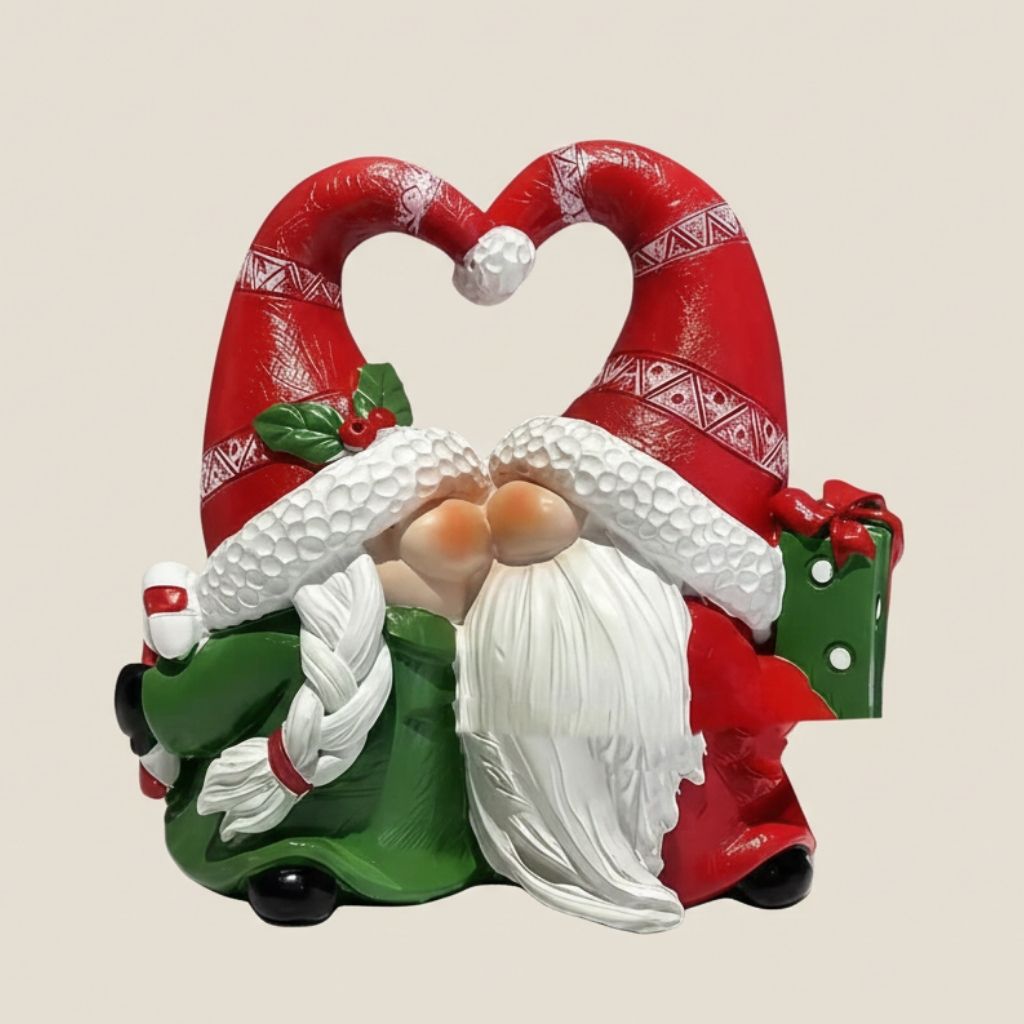 Festive resin gnome decoration featuring holiday couple with red and green details