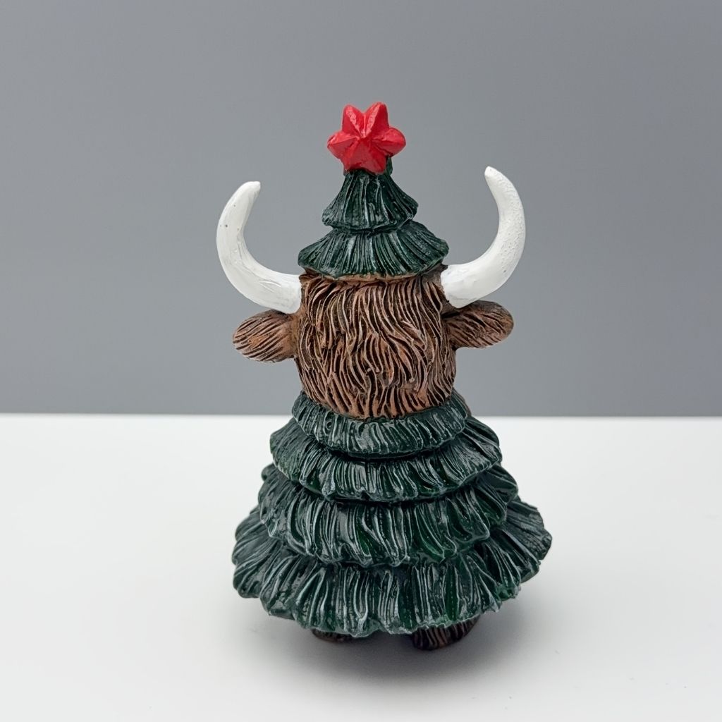 Highland cattle head ornament dressed in christmas tree outfit with decorative accents