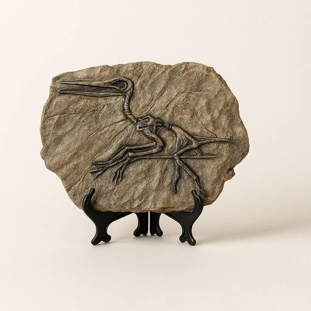 Decorative stone with a bird design on a stand against a beige background