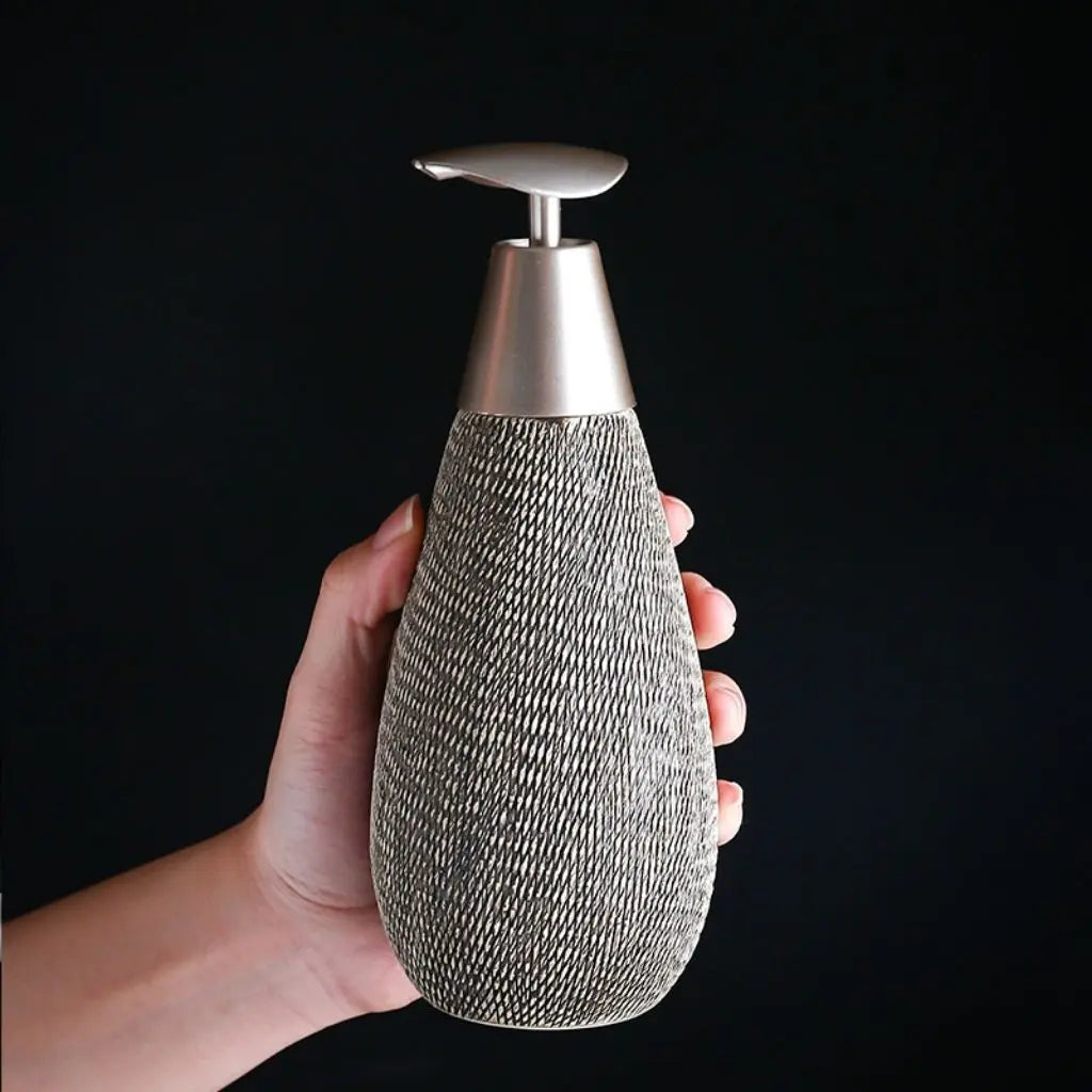 Japanese ceramic soap dispenser featuring brushed texture and retro styling for bathroom use