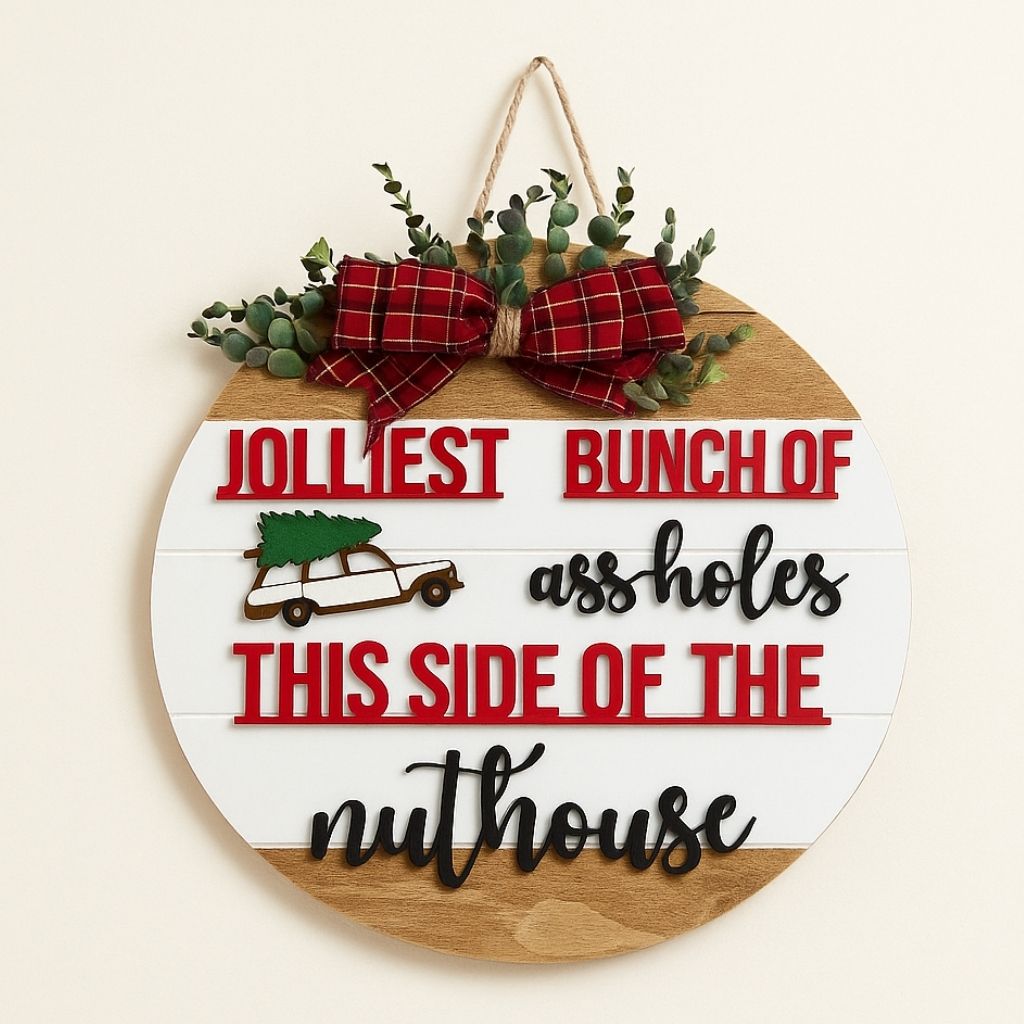 Wooden door hanger with festive holiday design and personalized name detail