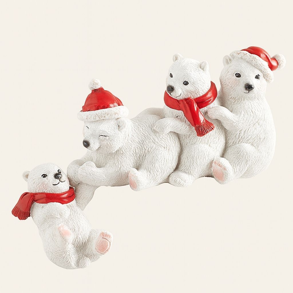 Set of white polar bear figurines with red scarves and hats on a light gray background