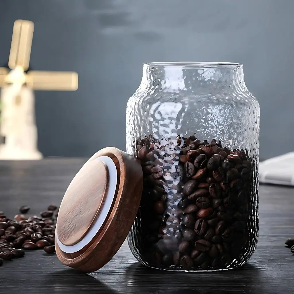 Clear glass storage container with acacia wood top for pantry essentials and food storage.