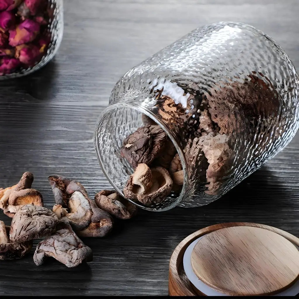Airtight glass jar with wooden lid perfect for spice storage and kitchen organization.
