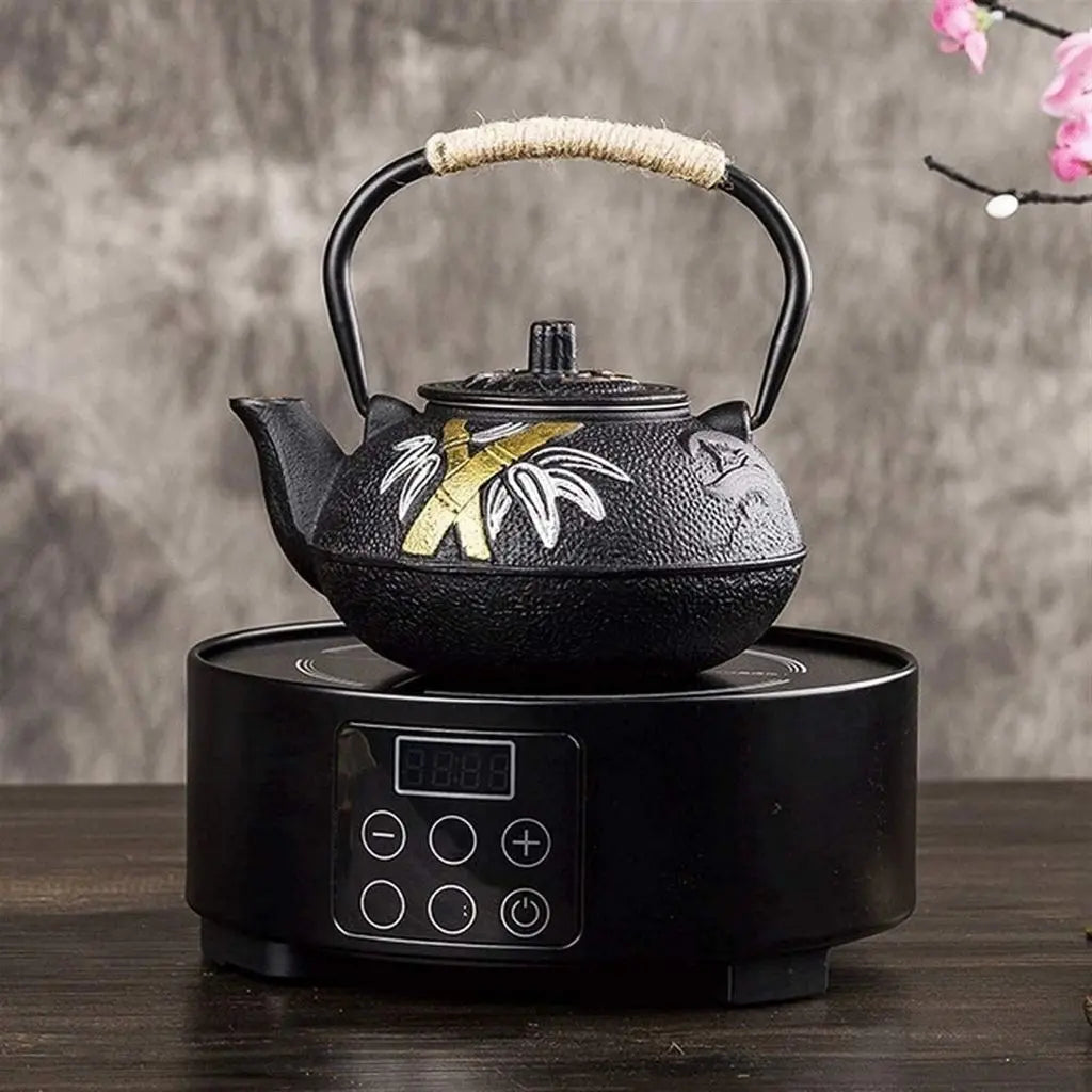Authentic Japanese cast iron teapot with artistic floral painting, perfect for traditional tea ceremonies
