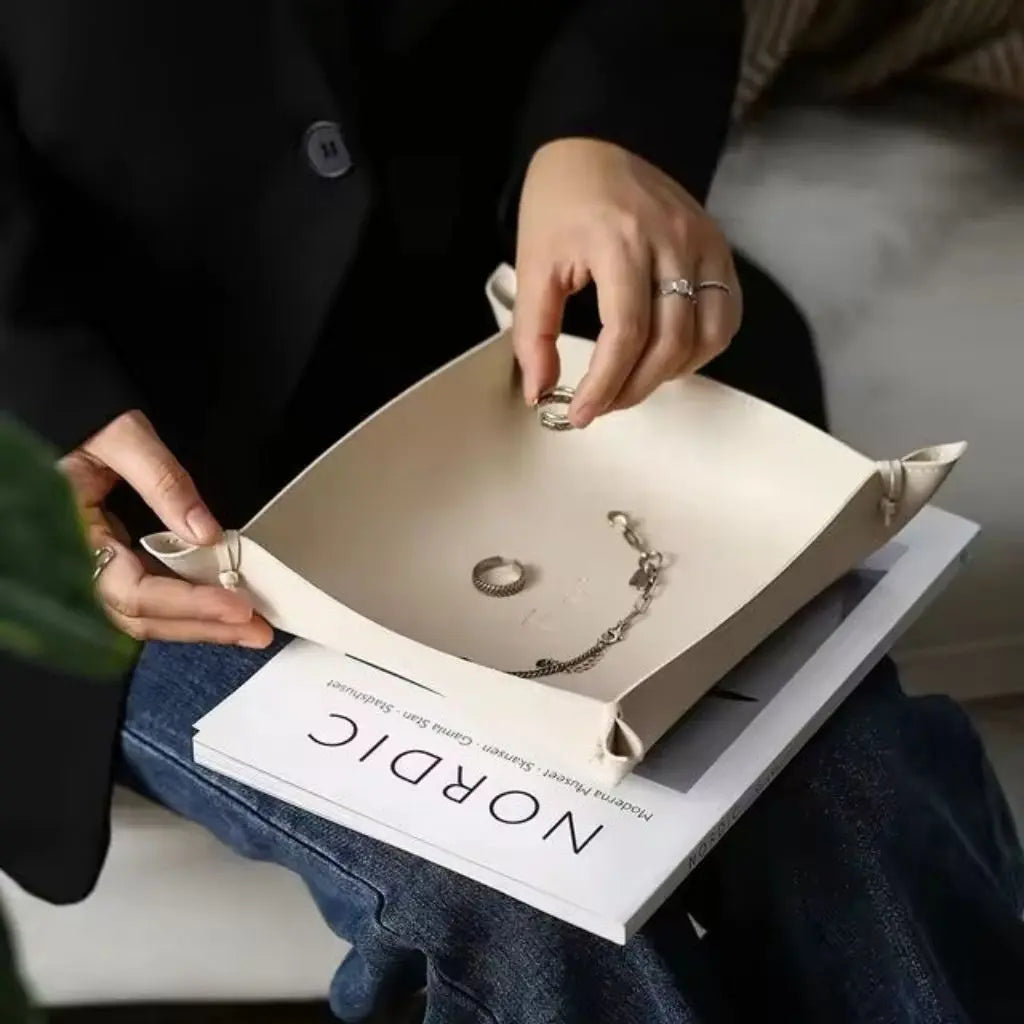 Wipeable leather storage tray demonstrating snap-up corner design for versatile home office organization