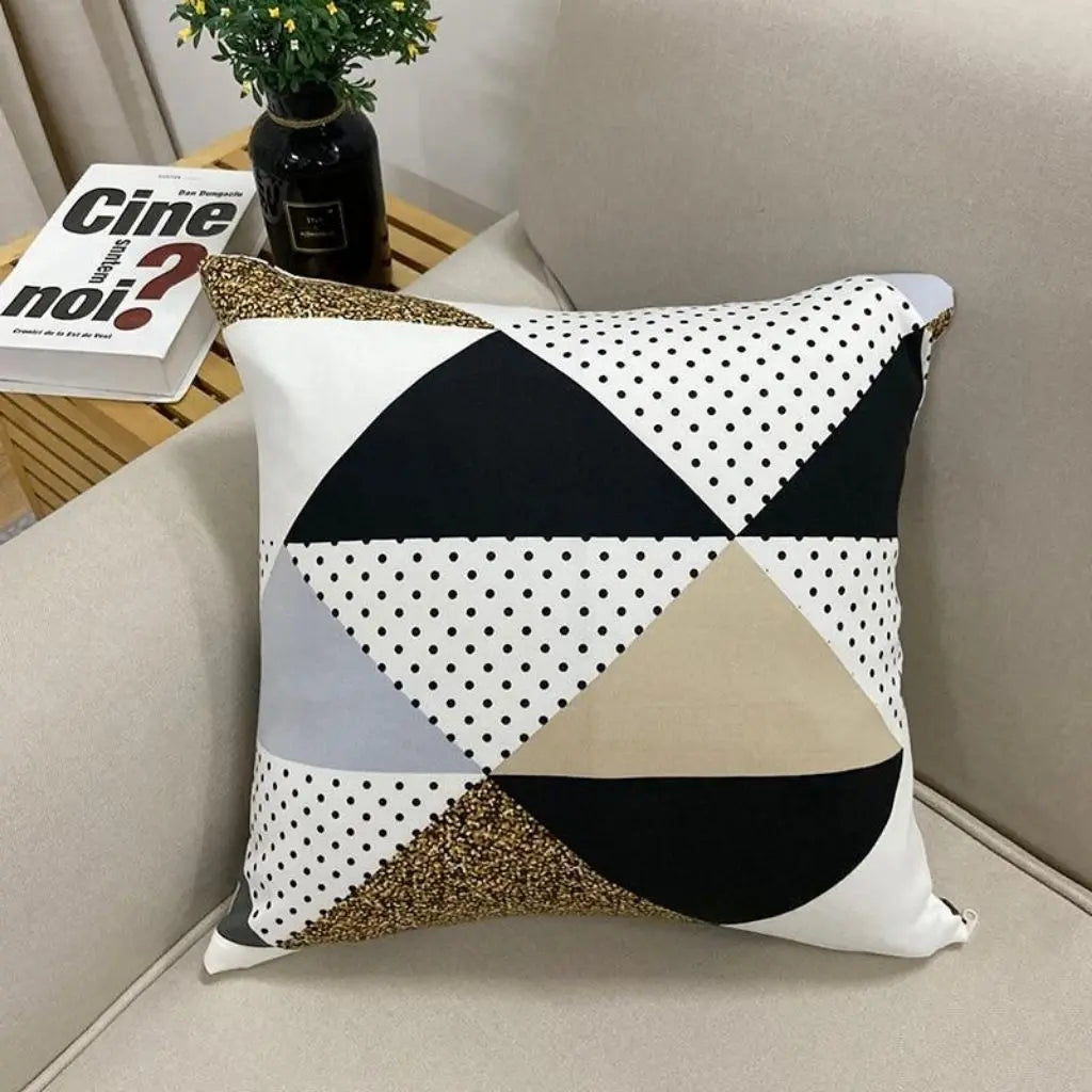 Set of 2 geometric throw pillow covers featuring black gold color blocking and textured abrasive cloth fabric