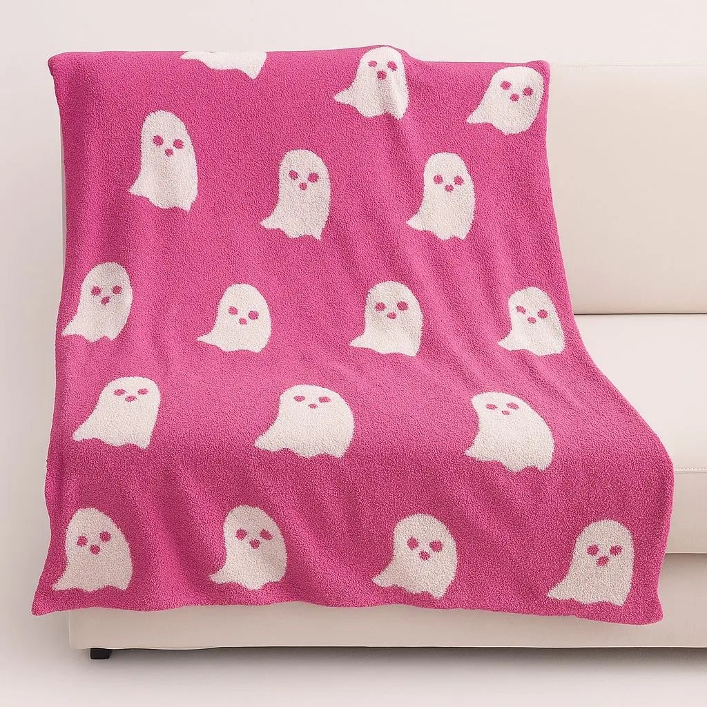 Seasonal throw blanket with charming ghost design, ideal knitted home textile for year-round use