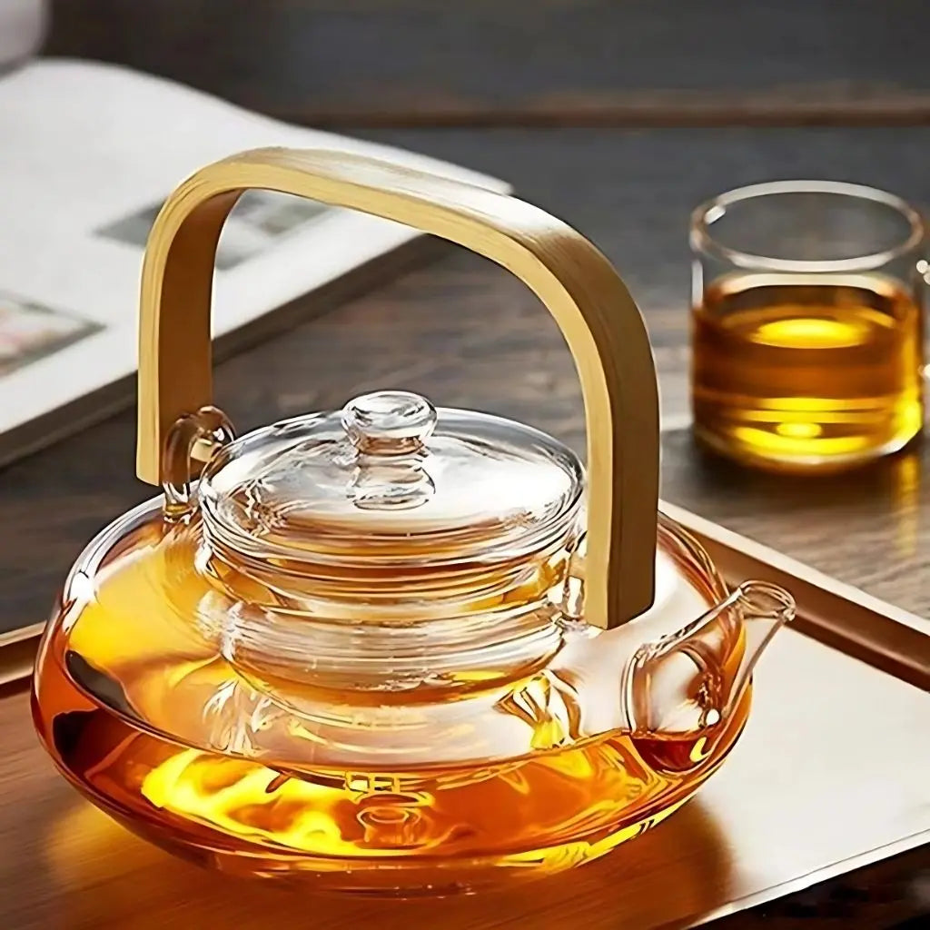 Elegant glass teapot with bamboo handle demonstrating dishwasher safe borosilicate construction
