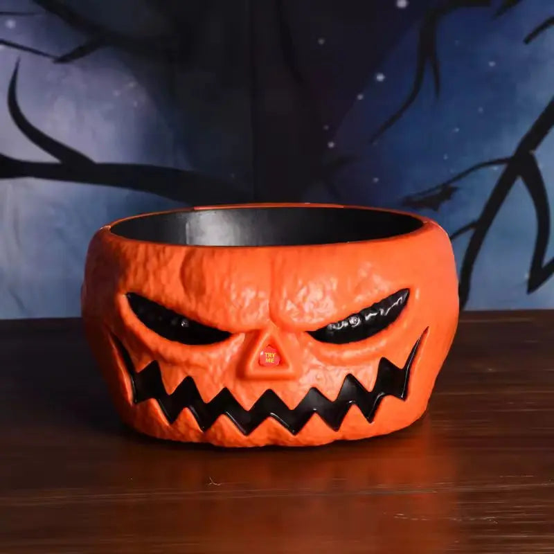 Halloween-themed pumpkin face bowl with a dark background