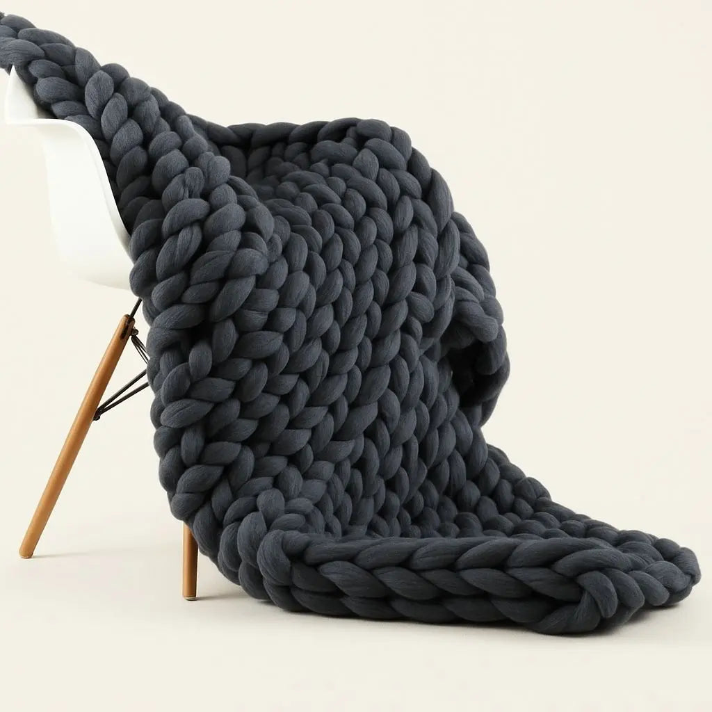 Hand-woven chunky knit blanket in wool chenille with oversized braided texture for cozy home décor
