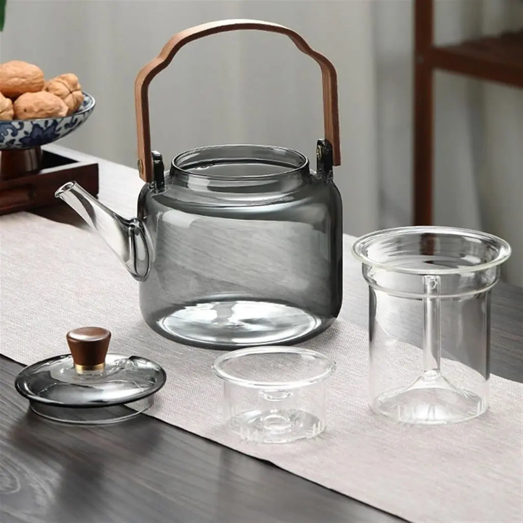 Elegant borosilicate teapot with ashwood handle perfect for stovetop brewing and sophisticated tea service