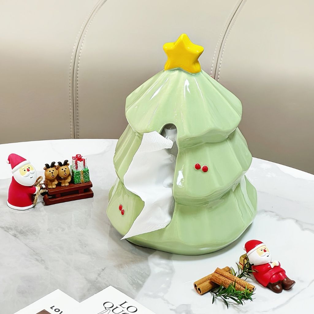 Ceramic tissue box shaped like Christmas tree with star topper and glossy green finish