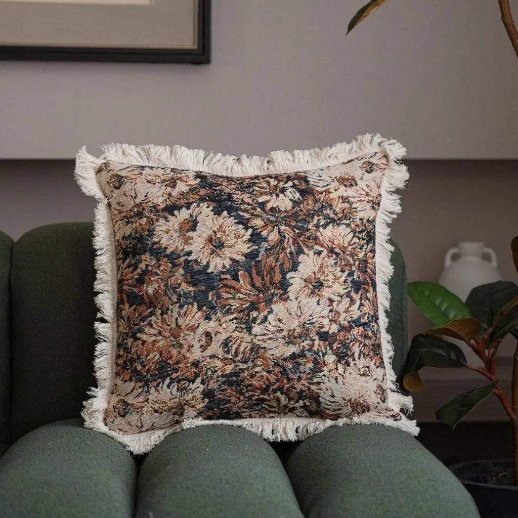 Tassel-trimmed jacquard pillow cover featuring bold geometric design in contrasting black and white