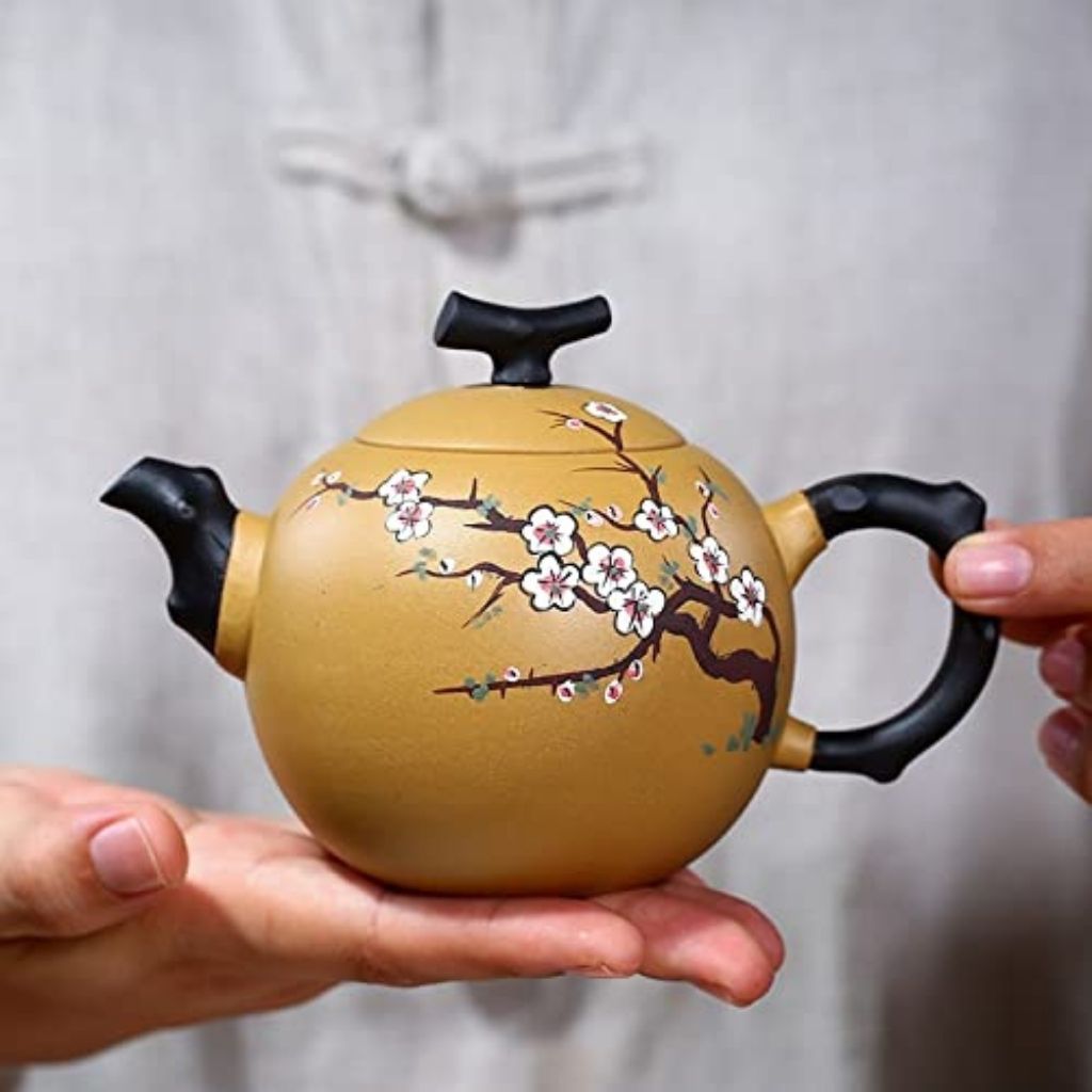 Top view of purple sand teapot with fitted lid and carved floral detailing