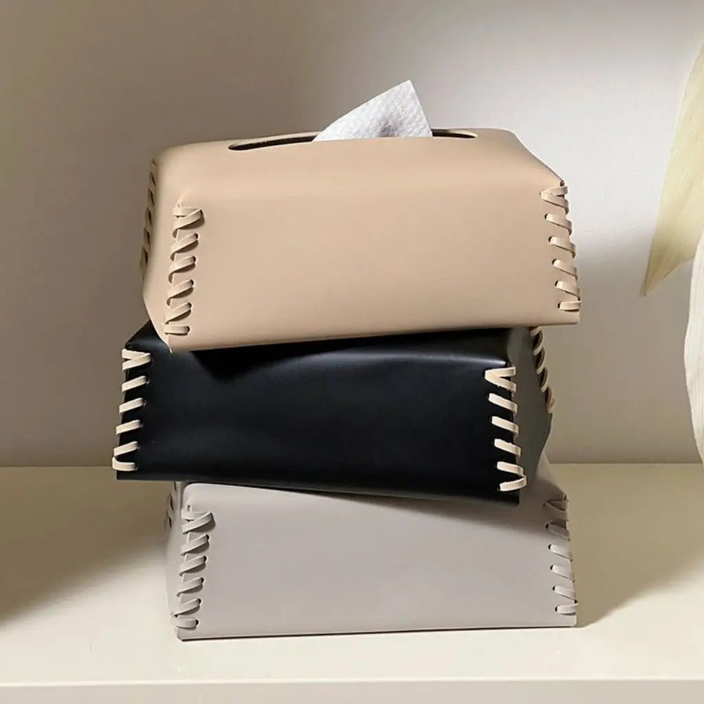 Modern leather tissue dispenser designed for easy access while protecting tissues from dust
