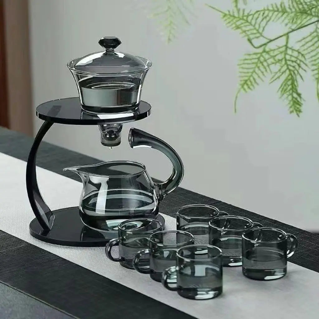 Stylish glass tea brewing system featuring automatic infuser, sturdy stand, and 6 serving cups
