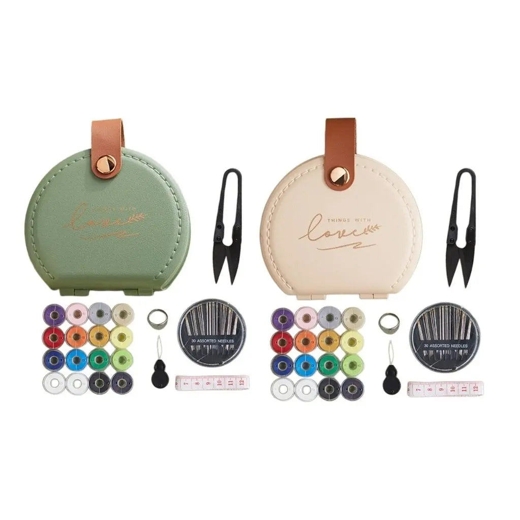 Complete portable sewing essentials featuring scissors, needles and colorful threads in durable case