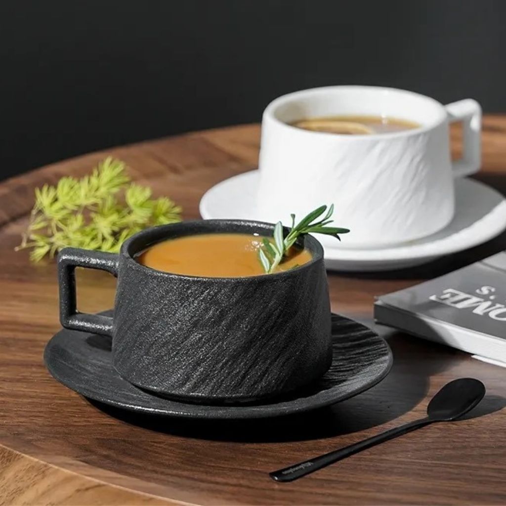 Artisan ceramic coffee cup with distinctive textured surface, handcrafted stoneware perfect for daily use