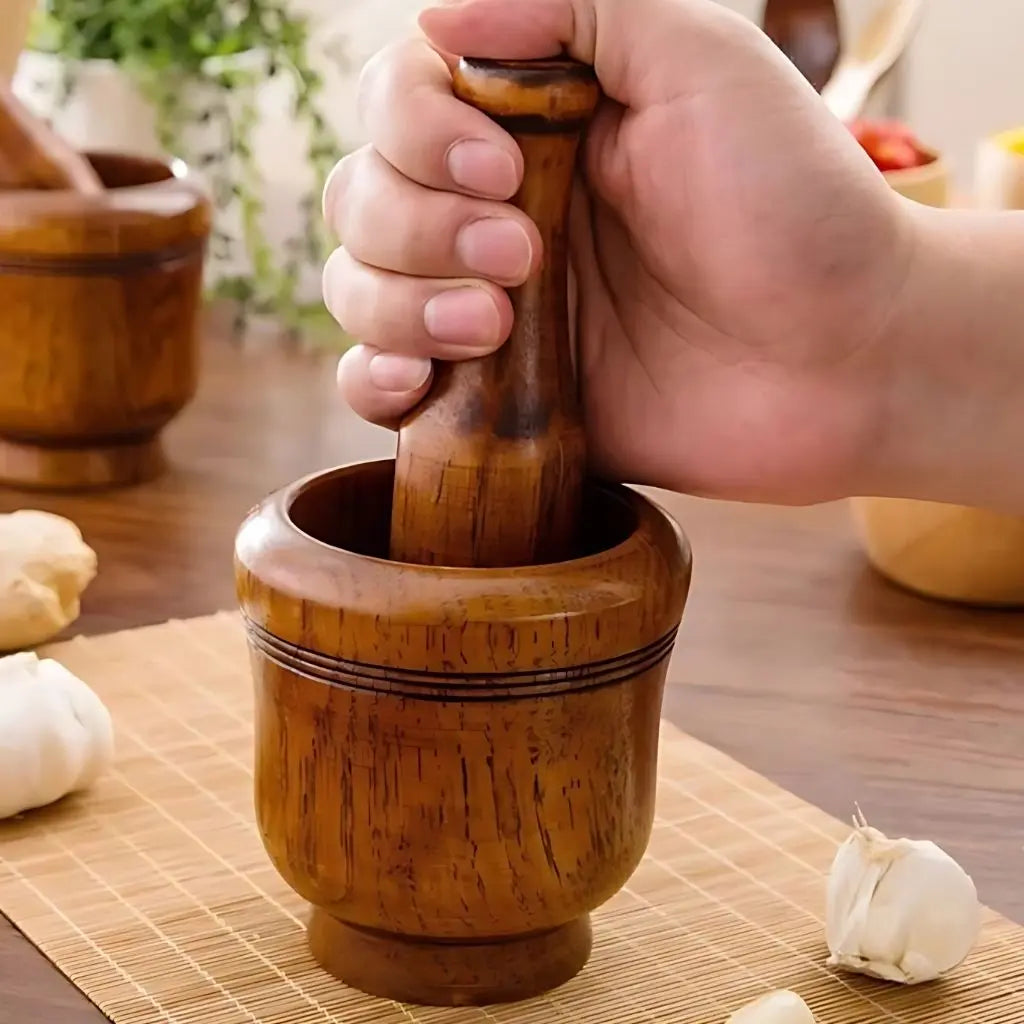 Wooden kitchen mortar with pestle featuring natural grain perfect for garlic grinding and herb crushing
