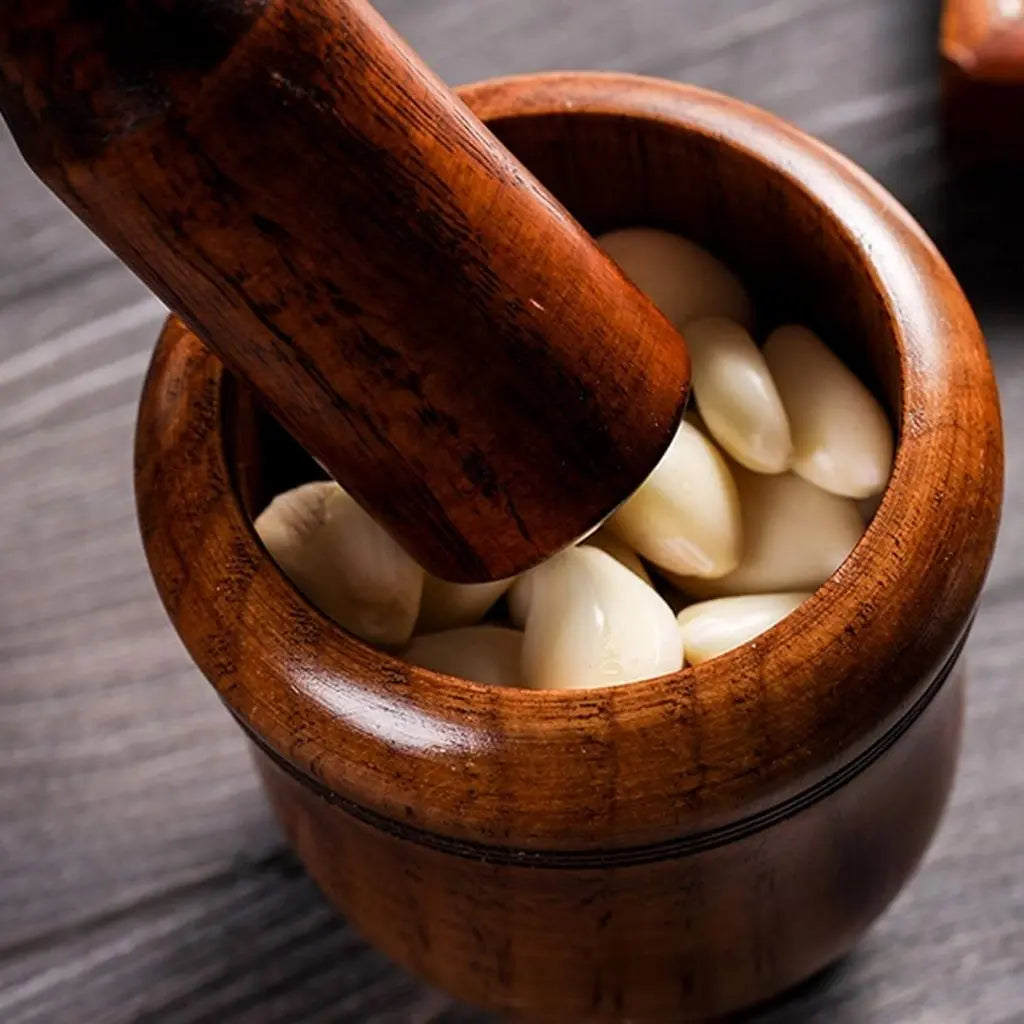 Wooden mortar and pestle set for grinding garlic and crushing herbs with natural wood construction
