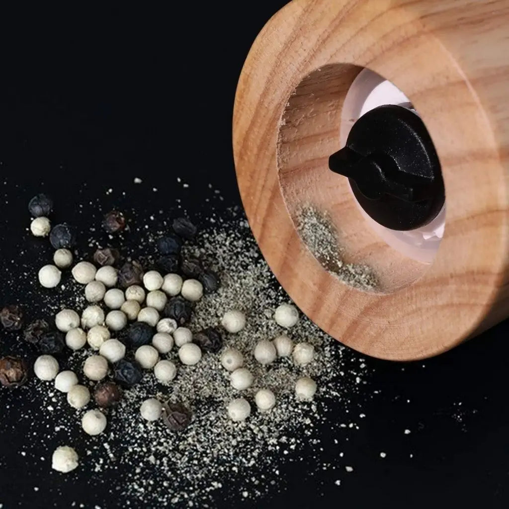 Ceramic spice grinder with wood finish showing adjustable grinding mechanism for fresh pepper