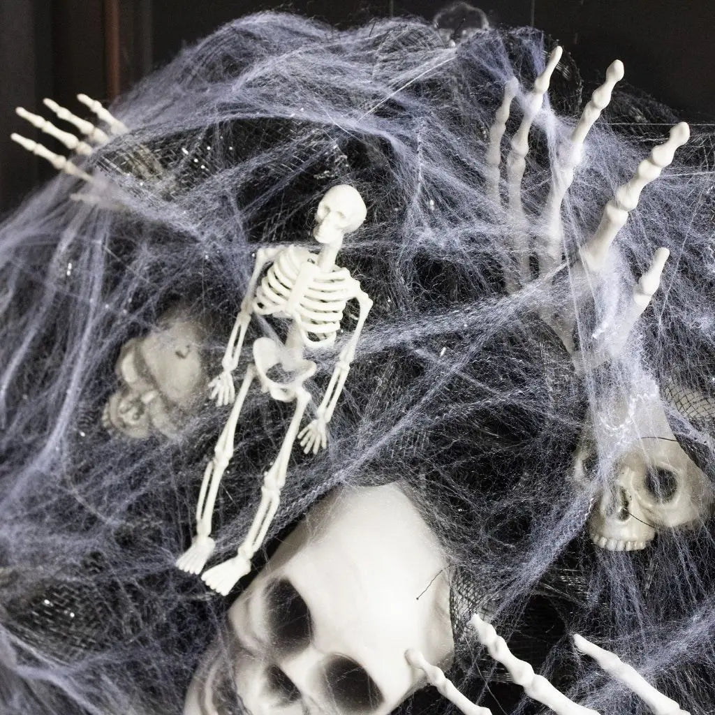 Halloween skull decor made from lightweight plastic mesh with realistic bone details for spooky accents