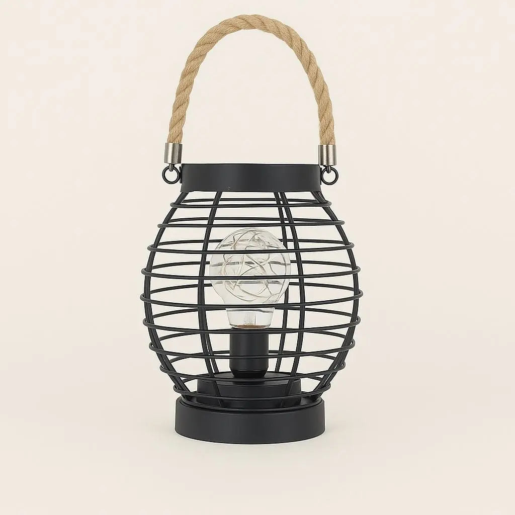 Black lamp wire cage lantern with a rope handle on a beige background