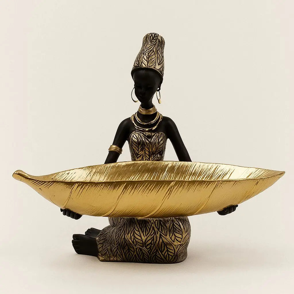 Mira Sculpture Storage Tray - African-inspired decorative figurine holding gold leaf-shaped serving bowl
