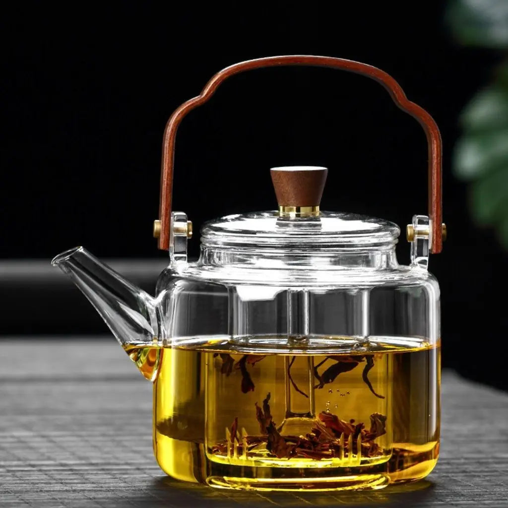 Elegant borosilicate teapot with ashwood handle perfect for stovetop brewing and sophisticated tea service