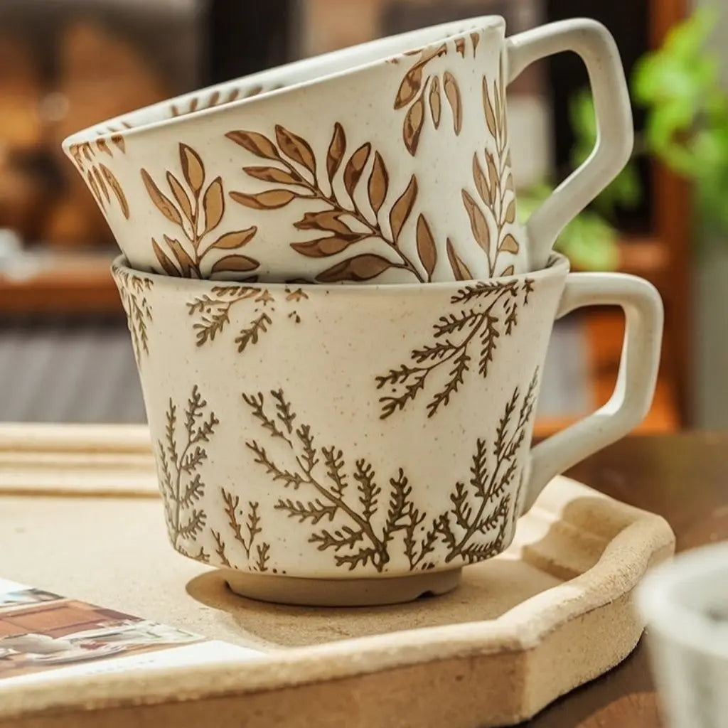 Nordic ceramic mug featuring botanical patterns, minimalist white porcelain design for coffee lovers