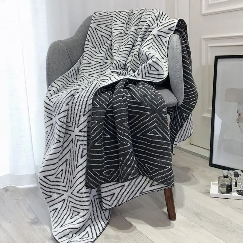 Geometric throw blanket featuring nordic design crafted from soft acrylic material for year-round use
