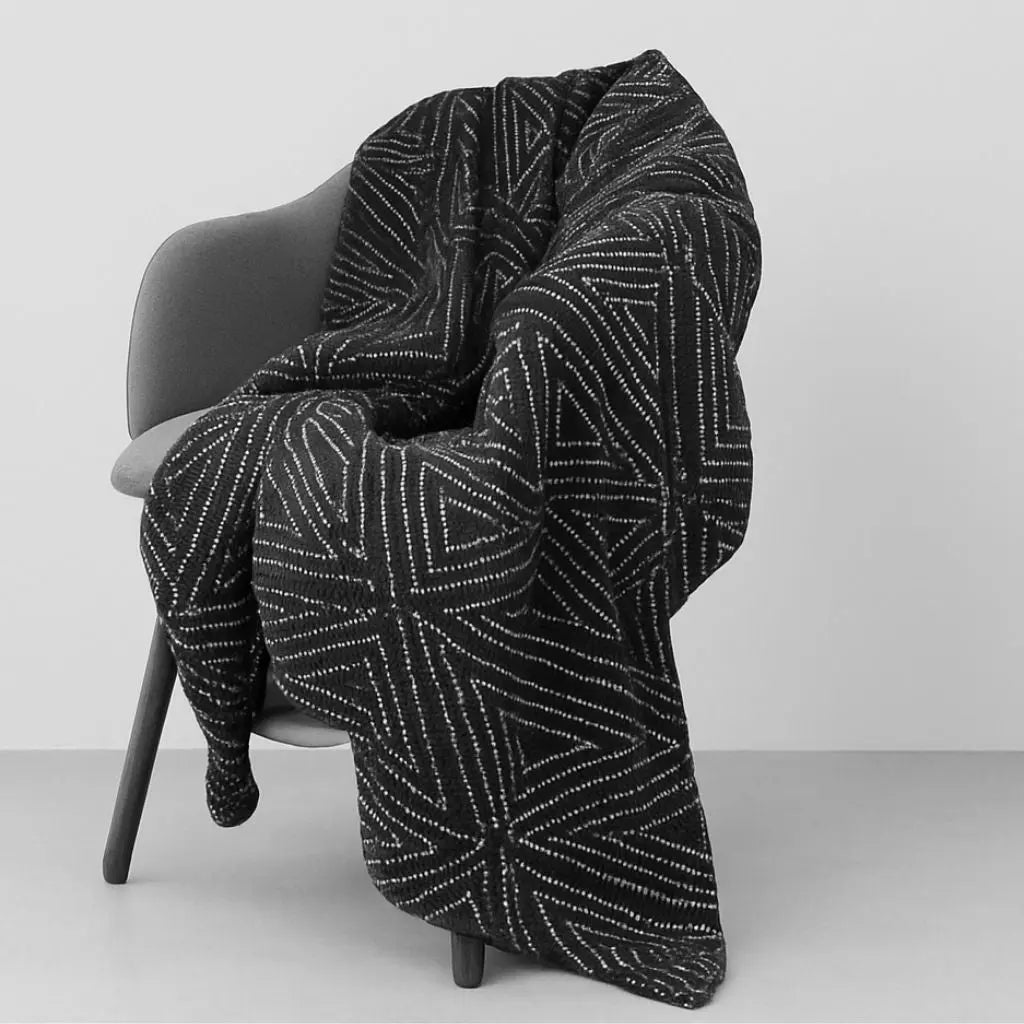 Scandinavian throw blanket with geometric knit design adding modern warmth to living spaces