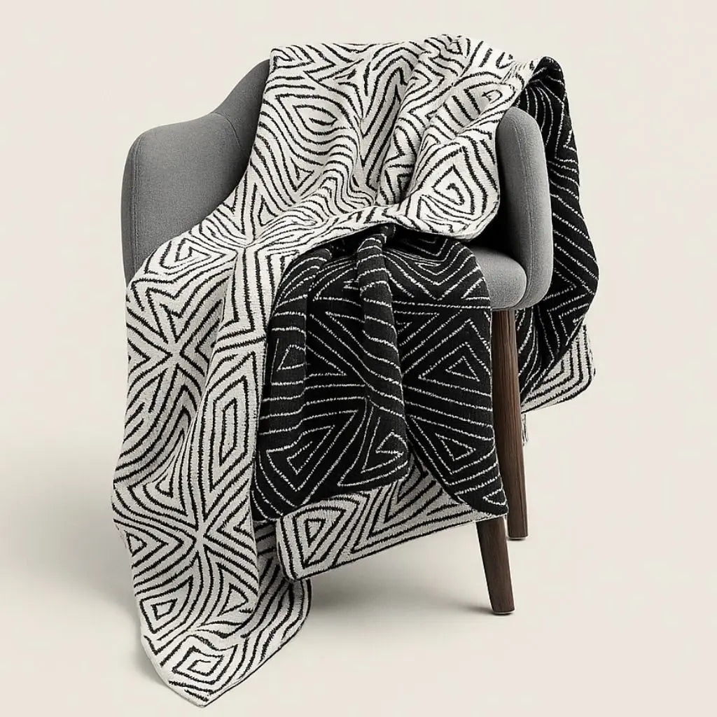 Nordic knit blanket with bold geometric pattern in black and white acrylic for cozy home comfort