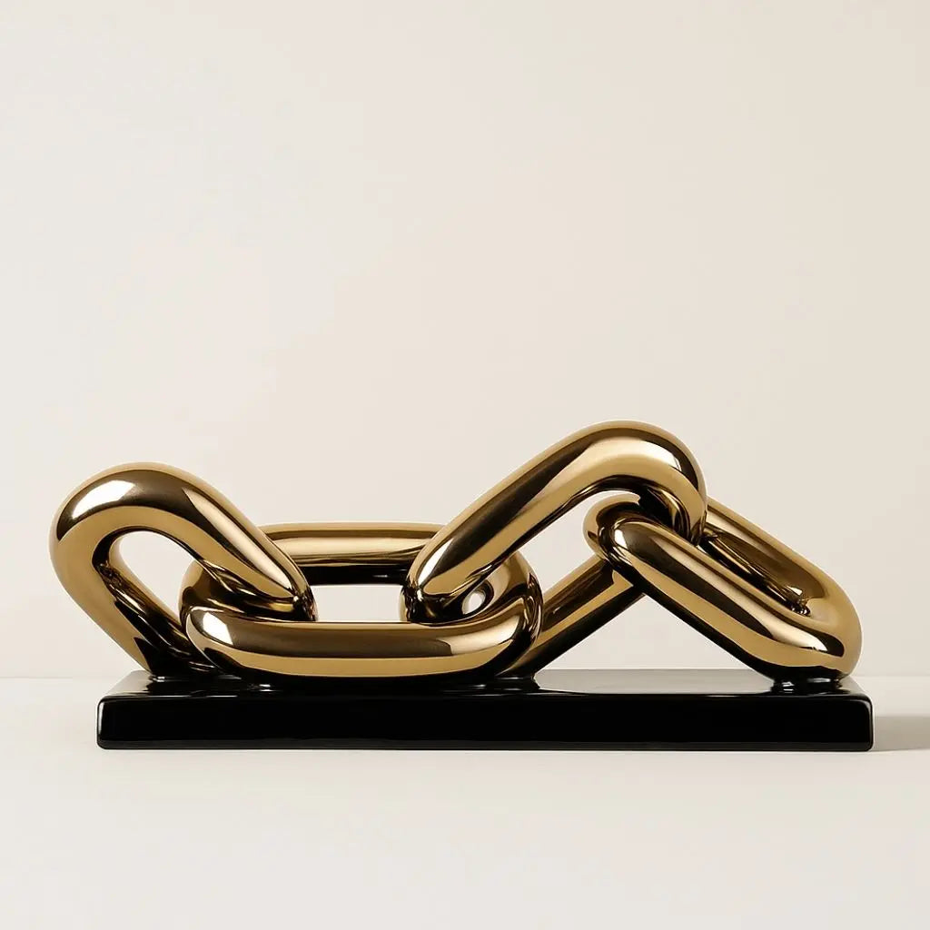 Gold chain sculpture on a white background
