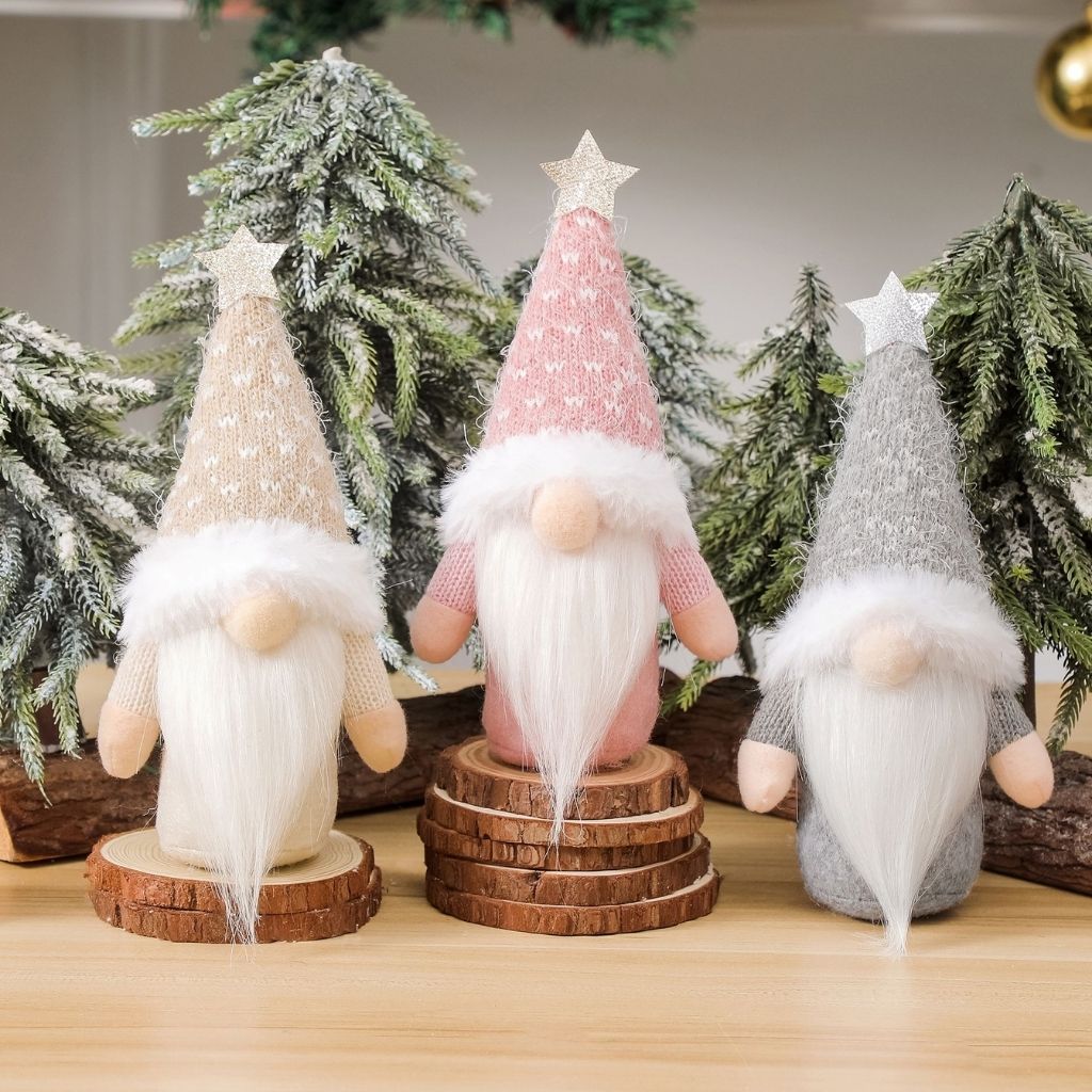 Handcrafted knitted gnome with weighted sandbag base and plush detailing