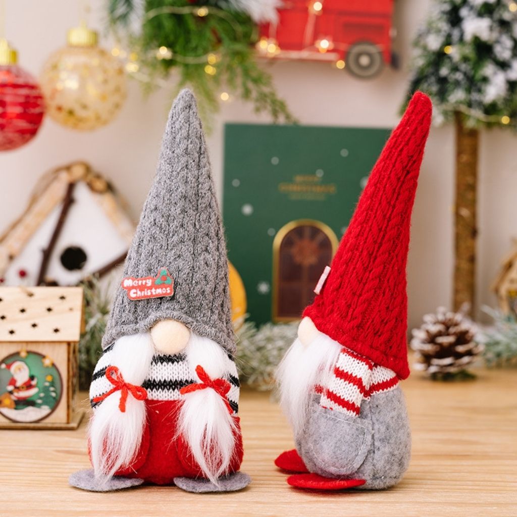 Pair of faceless gnomes with red and gray knitted hats for coordinated Christmas decor