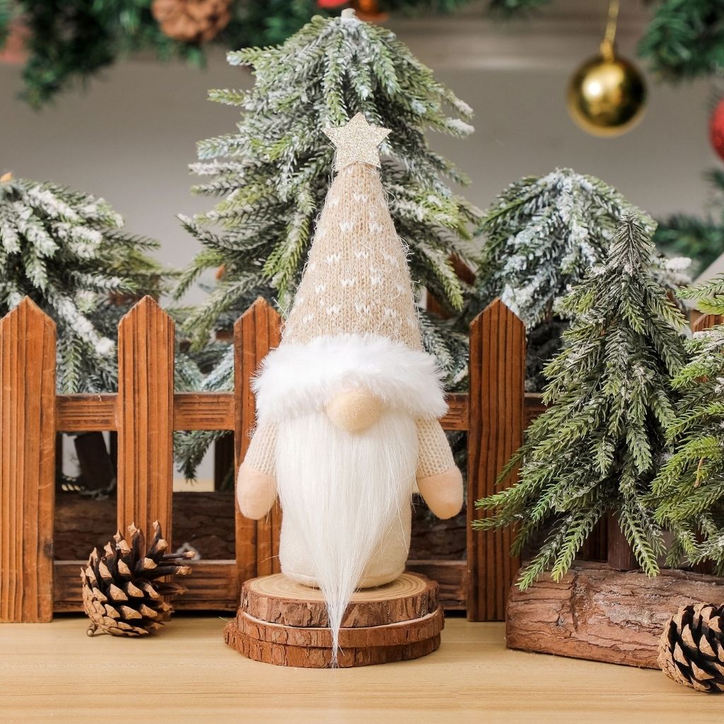 Holiday gnome figure with neutral knitted cloth body and star hat detail