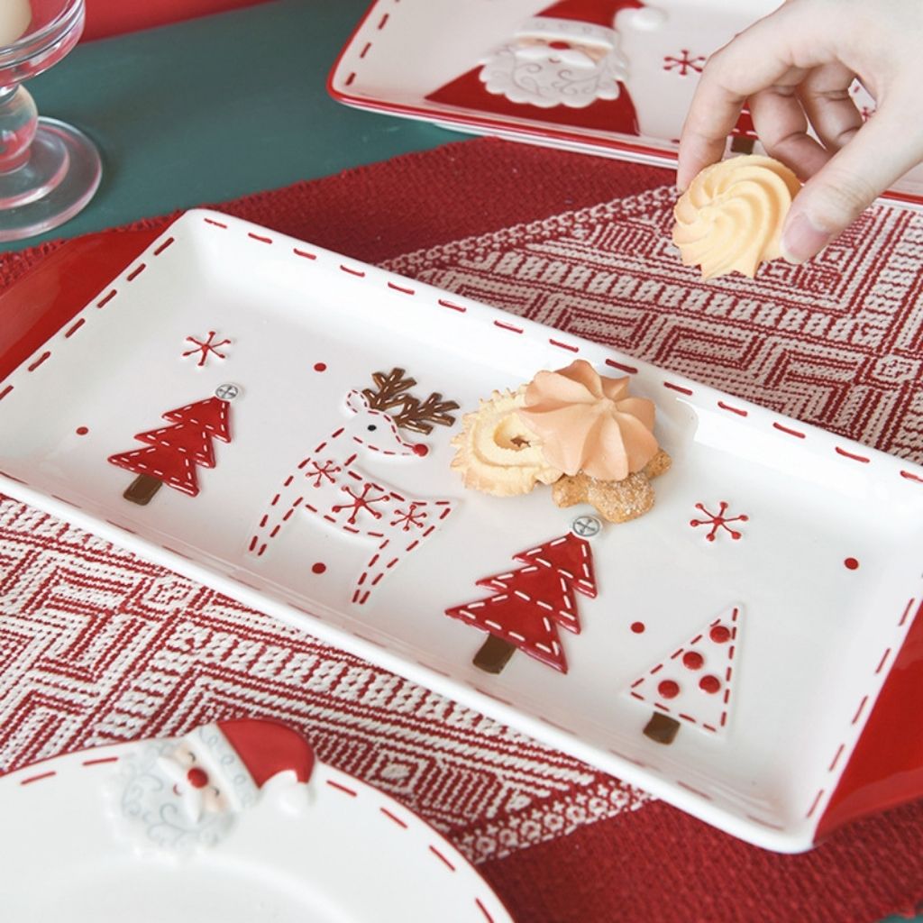 Ceramic holiday serving platter with printed festive artwork and handle grips