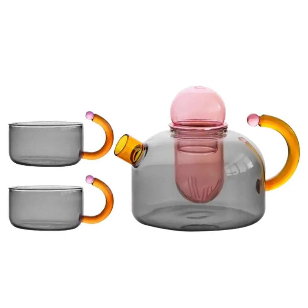 Complete glass teapot ready for use, featuring heat resistant borosilicate construction with colorful design